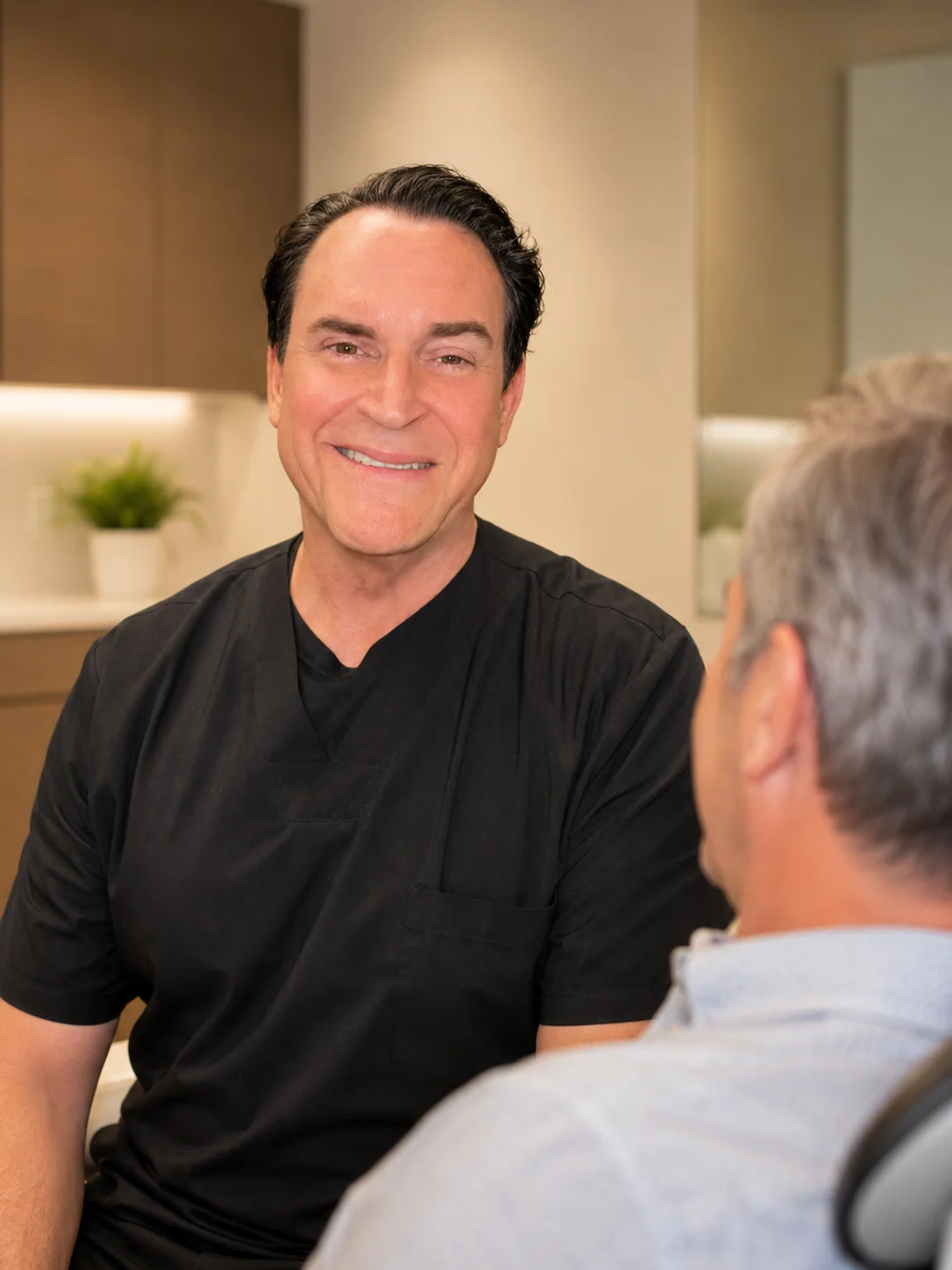 Dr. Chris Cappetta reviewing a NightLase treatment plan with a patient in San Antonio TX